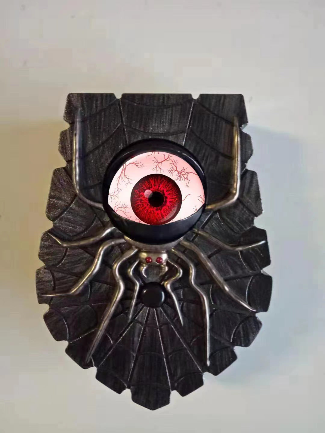 Black and red haunted doorbell