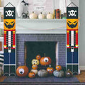 Skeleton nutcracker banners beside a fireplace
