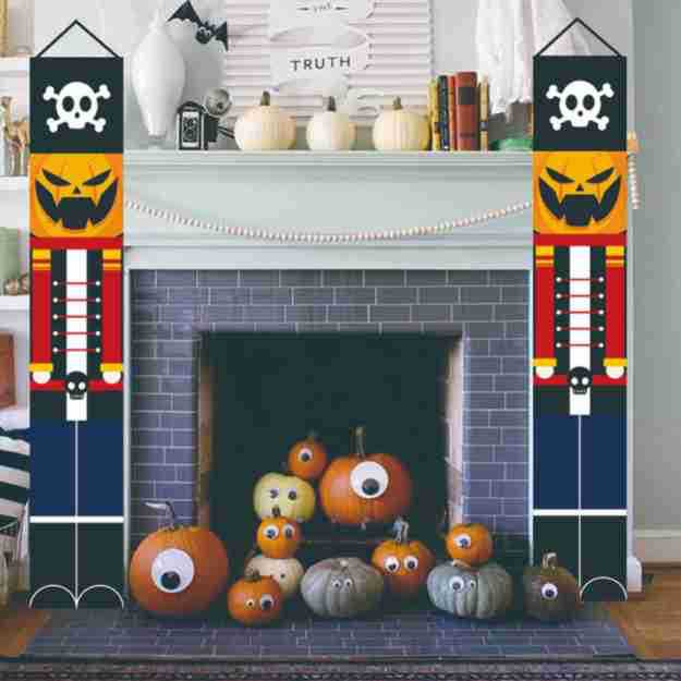 Skeleton nutcracker banners beside a fireplace