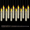 Floating LED candles glowing against a dark background