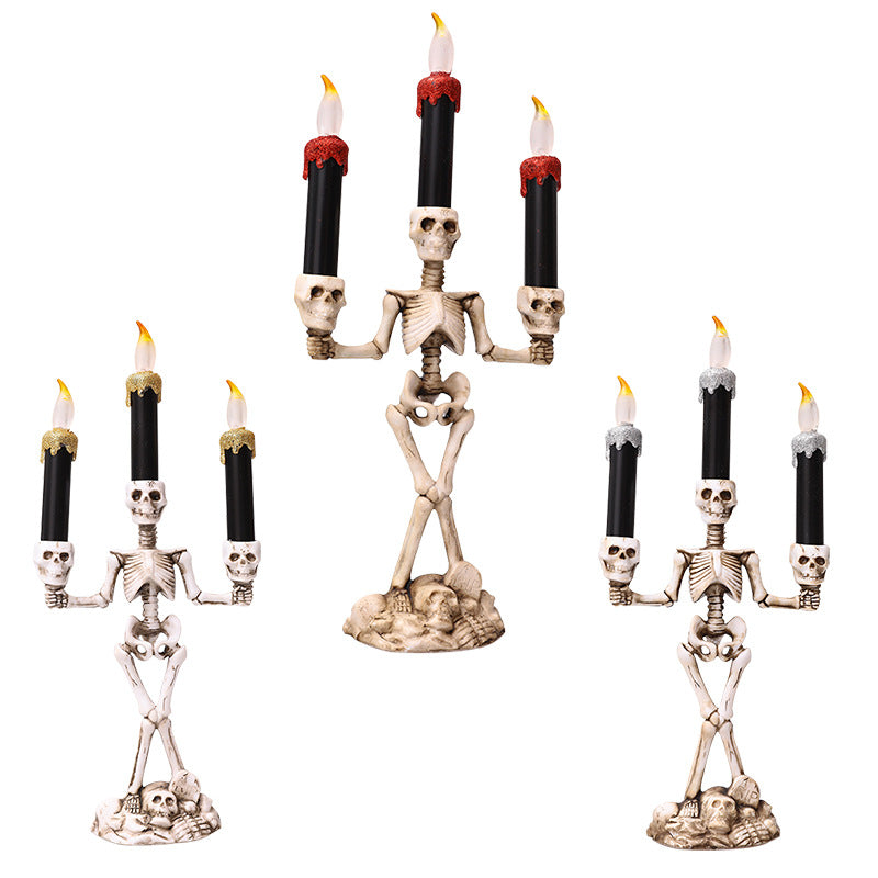 Gold skeleton hand candelabra