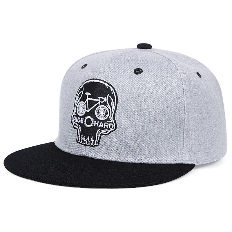 Grey snapback with embroidered skull patch