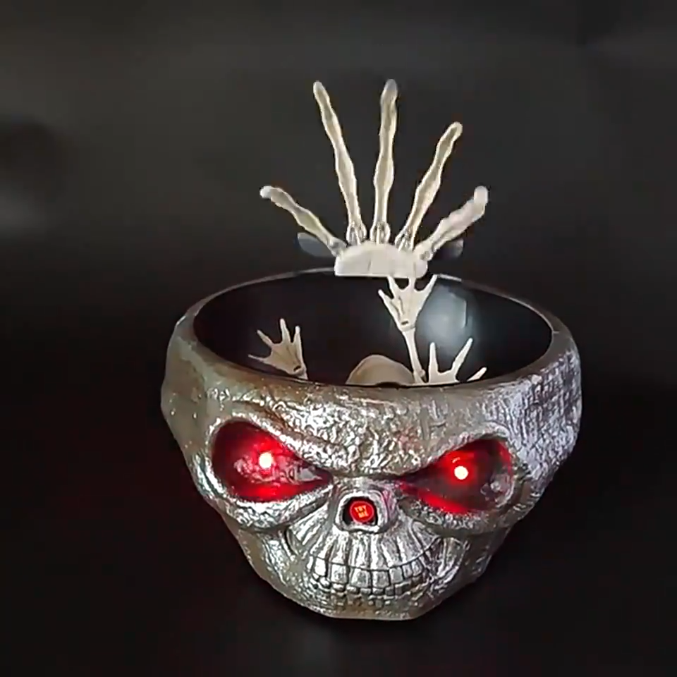 Skull sweet bowl with a moving skeleton hand